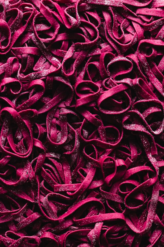 Vibrant Purple Pasta Dough Ribbons Wallpaper Background