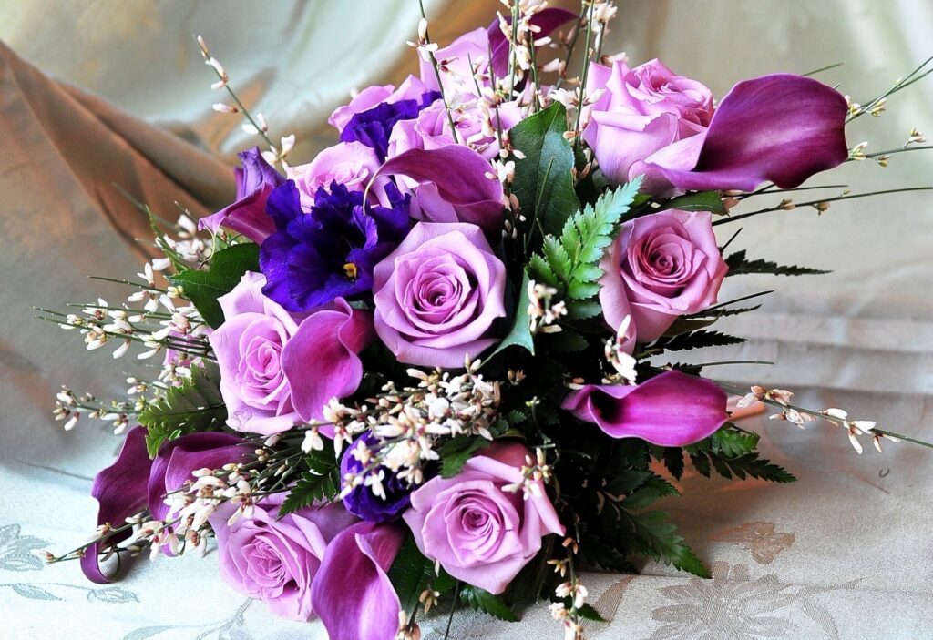Vibrant Purple & Pink Roses with Calla Lilies Wallpaper Background