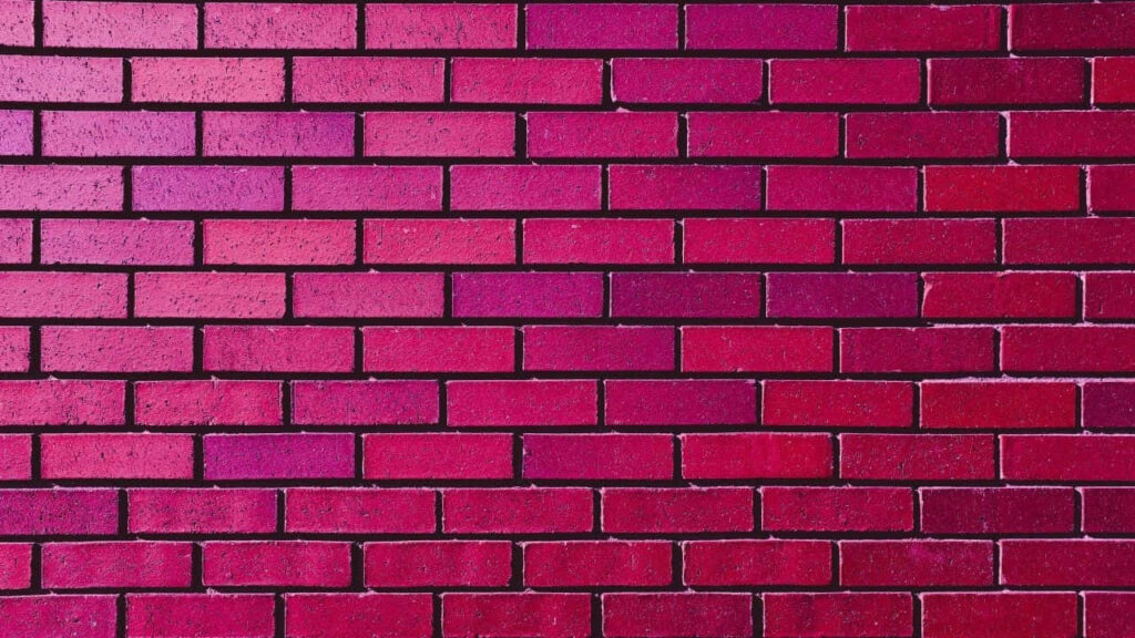 Vibrant Purple Textured Brick Wall Wallpaper Background