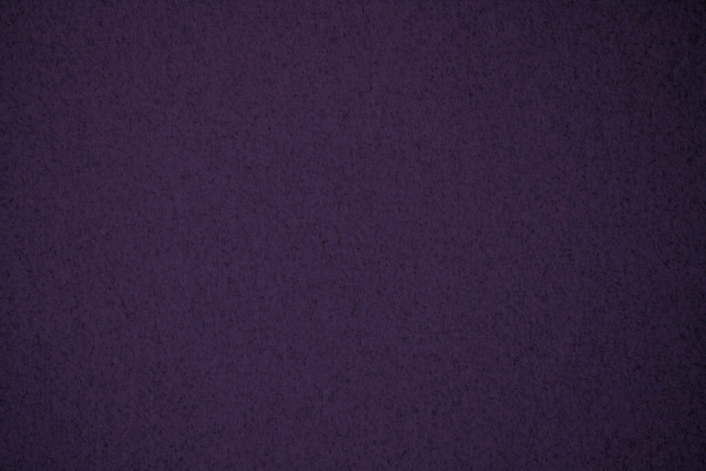 Vibrant Purple Textured Wallpaper with Subtle Grainy Pattern