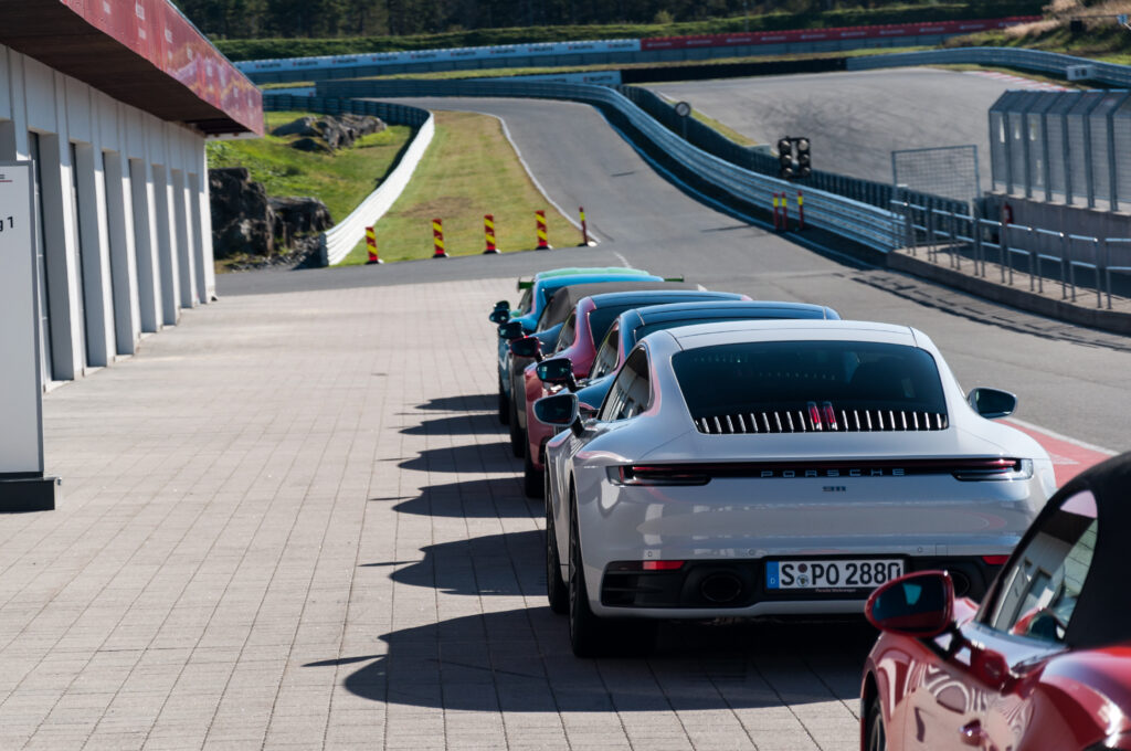Colorful Cars on a Race Track - Vibrant Wallpaper Background