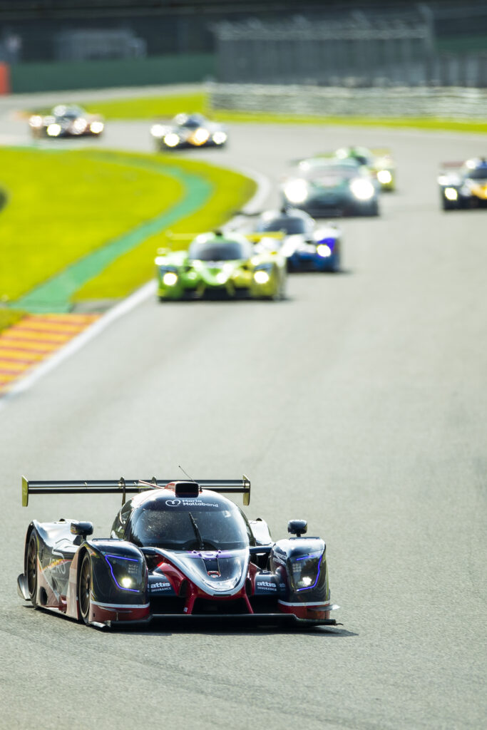Vibrant Racing Cars Wallpaper: Thrilling Motorsport Action Background