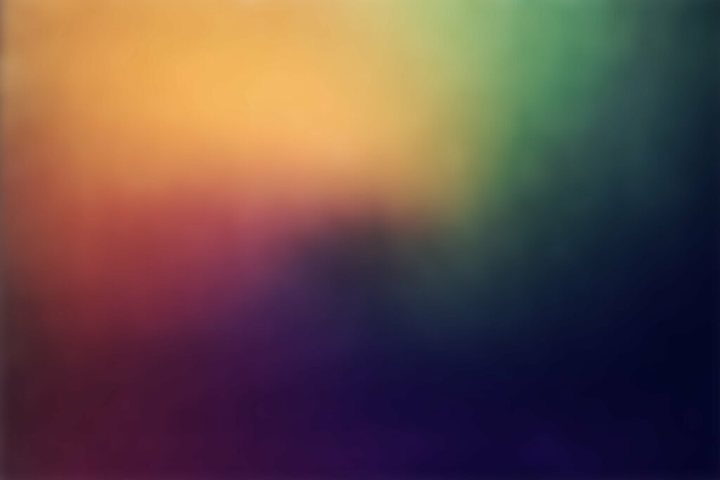 Vibrant Abstraction: Rainbow Hues Merge in a Blur Wallpaper