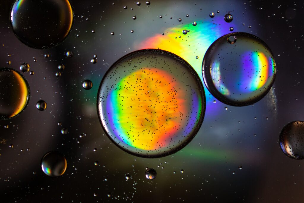 Vibrant Rainbow Bubble Macro Wallpaper on Dark Background