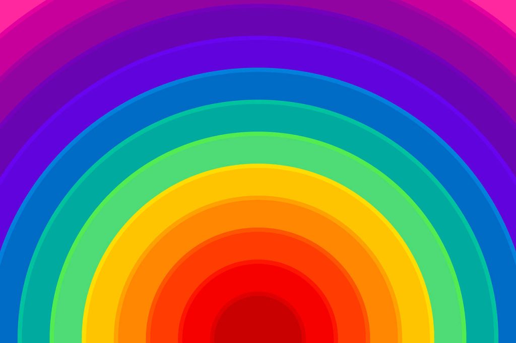 Vibrant rainbow semicircle wallpaper with bold colorful concentric arches brightening screen