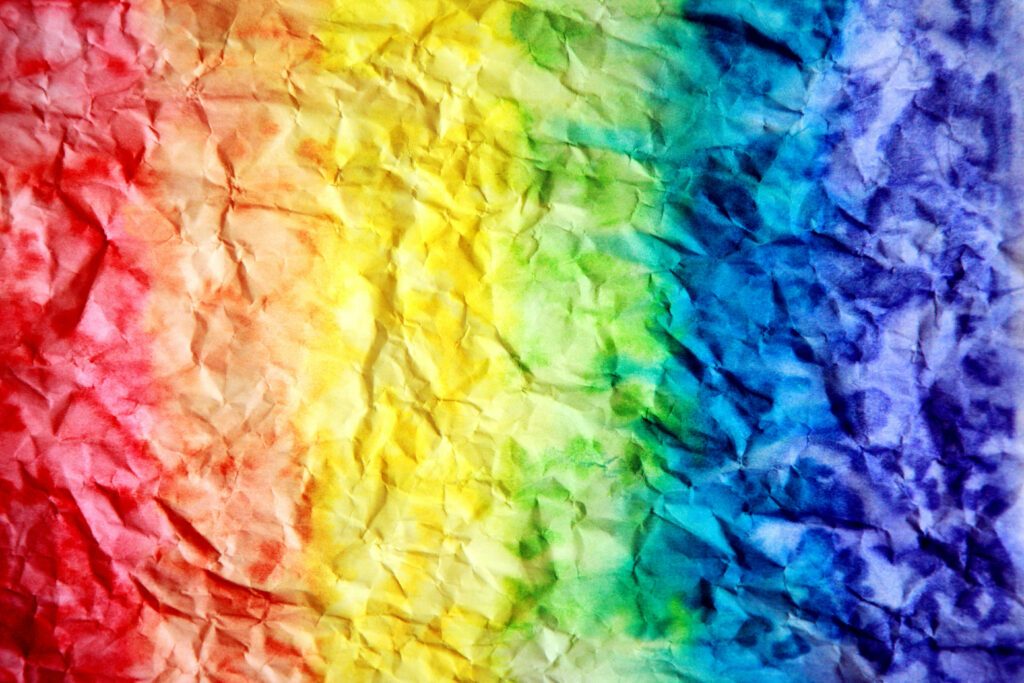 Vibrant Crumpled Paper Wallpaper: Seamless Rainbow Gradient Background