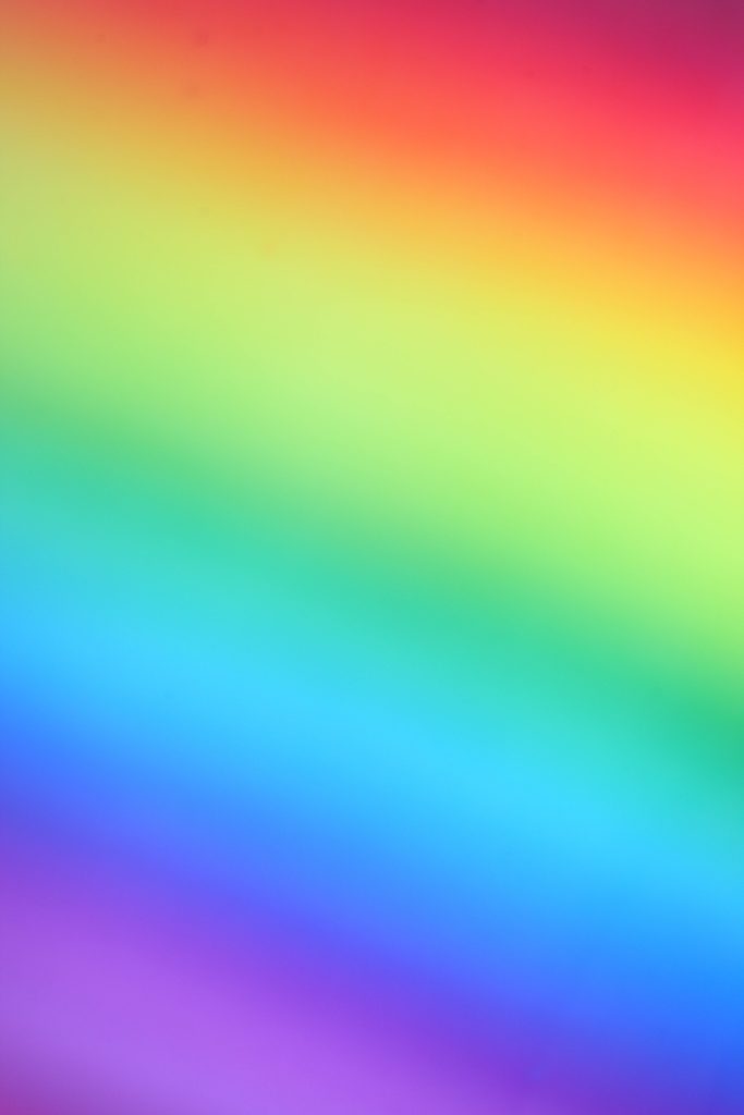 Vibrant rainbow wallpaper with smooth blurred diagonal gradient perfect for modern minimalist screens