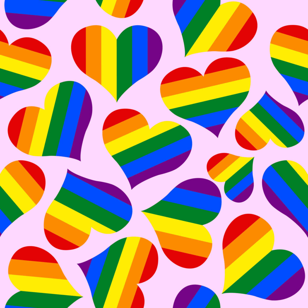 Vibrant Rainbow Hearts Wallpaper on Soft Pink Background