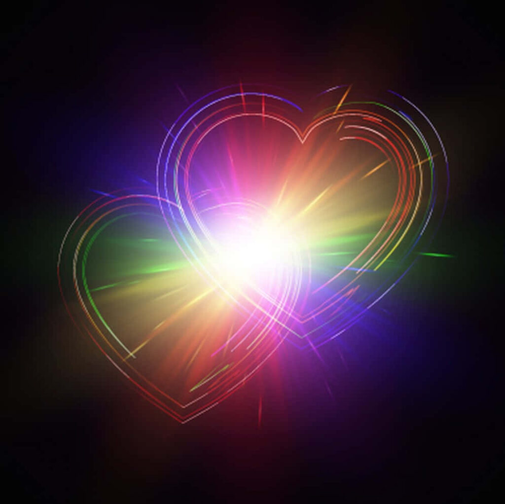Vibrant Rainbow Heart Wallpaper with Radiant Light Effects