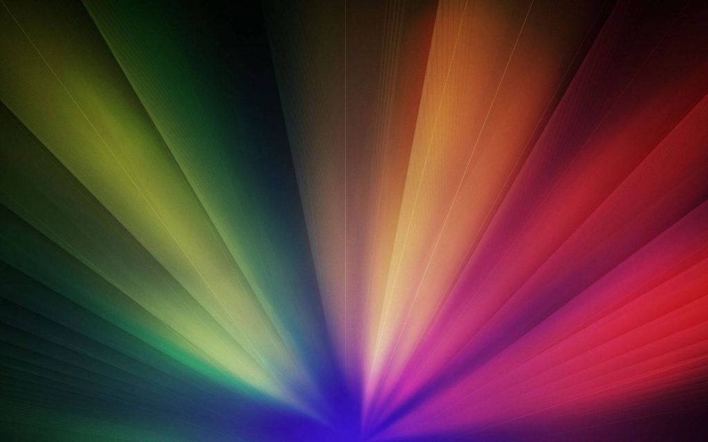 Abstract rainbow rays wallpaper with vibrant green orange red beams for modern screen background