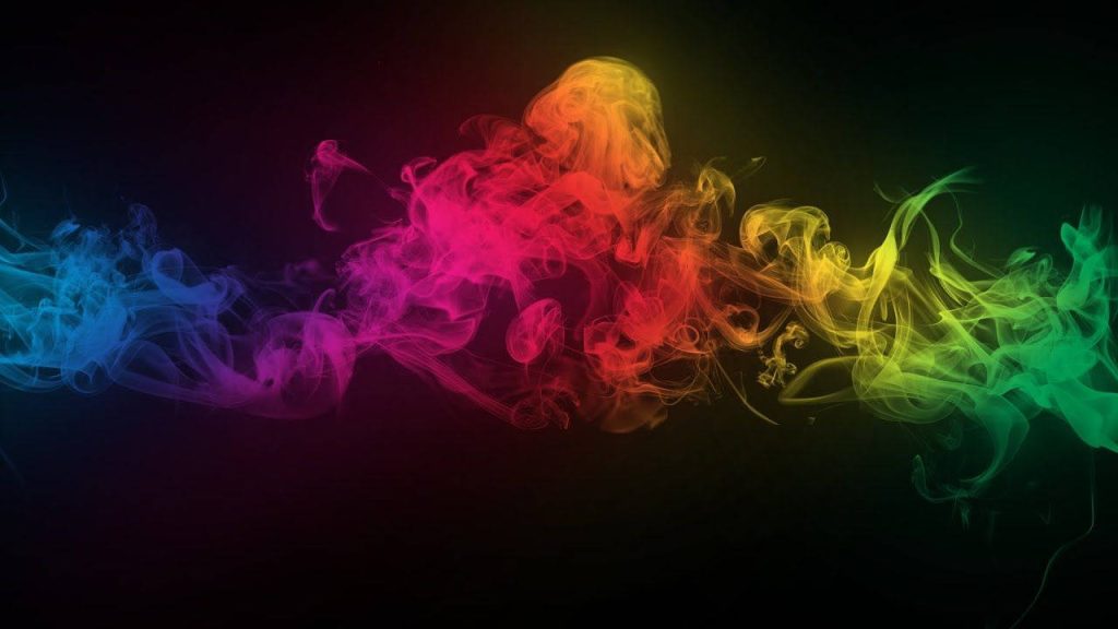 Vibrant rainbow smoke swirling on black background vibrant abstract digital art wallpaper background