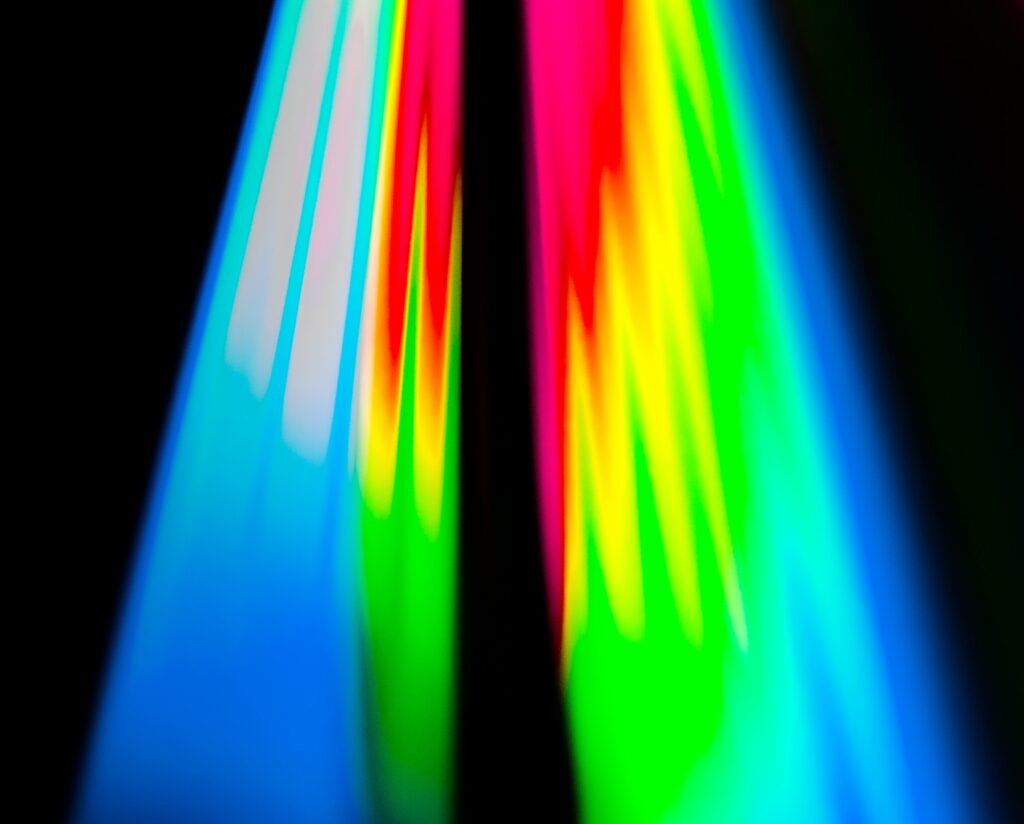 Vibrant Rainbow Stripes Wallpaper on Black Background - Captivating Design