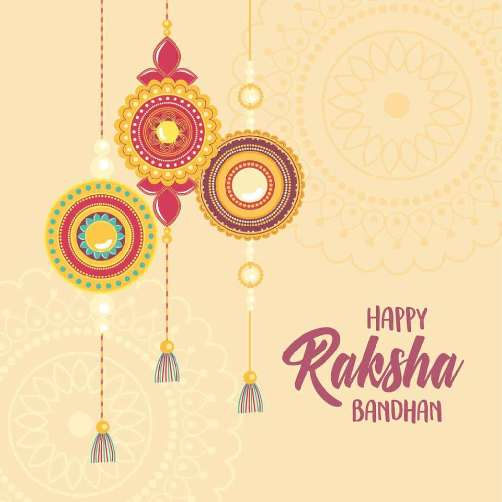 Three vibrant traditional rakhis hanging against cream background Raksha Bandhan festive greeting card Wallpaper