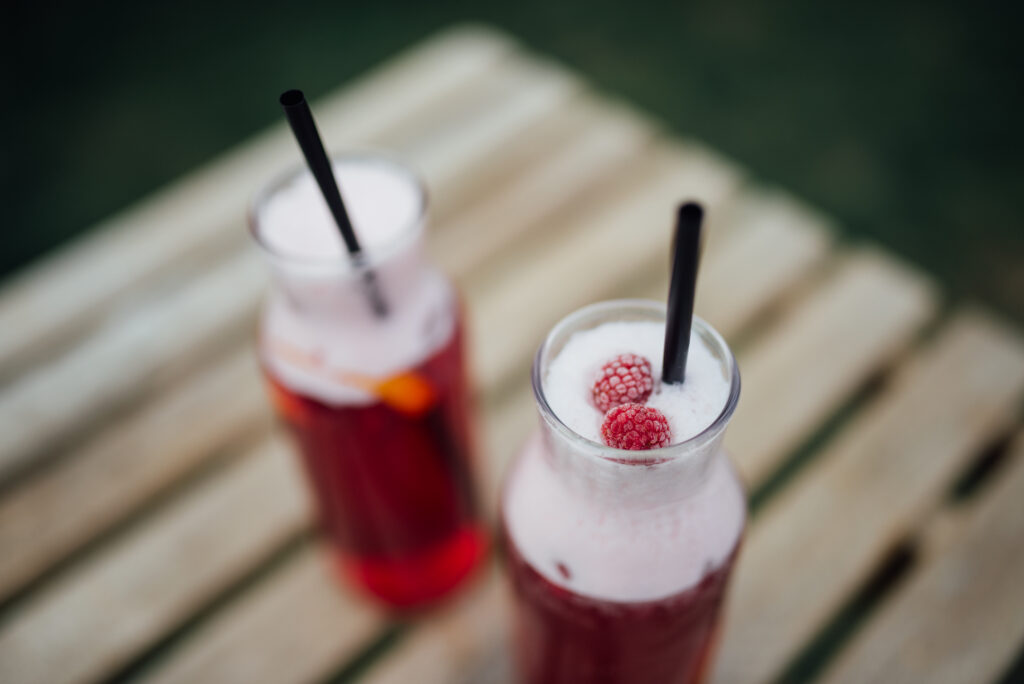 Vibrant Raspberry Cocktail Wallpaper: Rustic Wooden Background