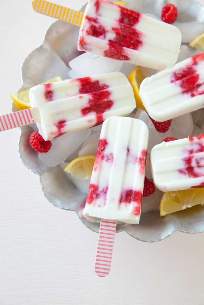 Vibrant Raspberry Popsicle Wallpaper with Lemon Slice Garnish