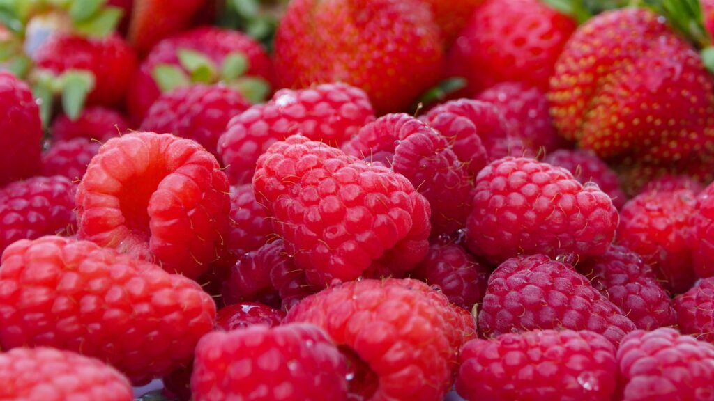 Vibrant Raspberry and Strawberry Wallpaper Background with Rich Colors