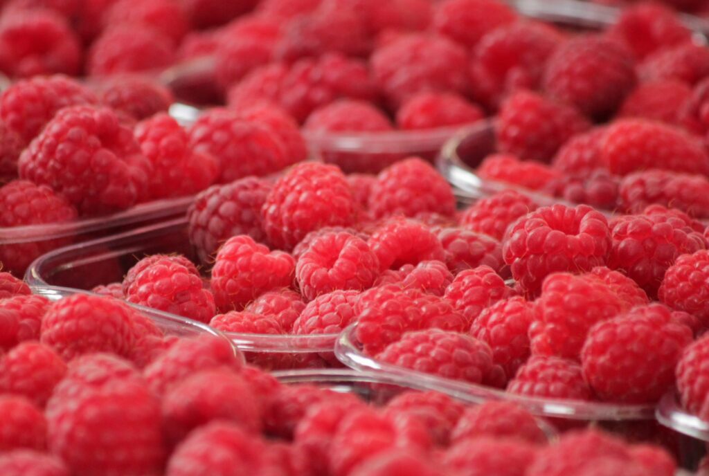 Vibrant Raspberry Wallpaper: Fresh Red Berries in Clear Bowls