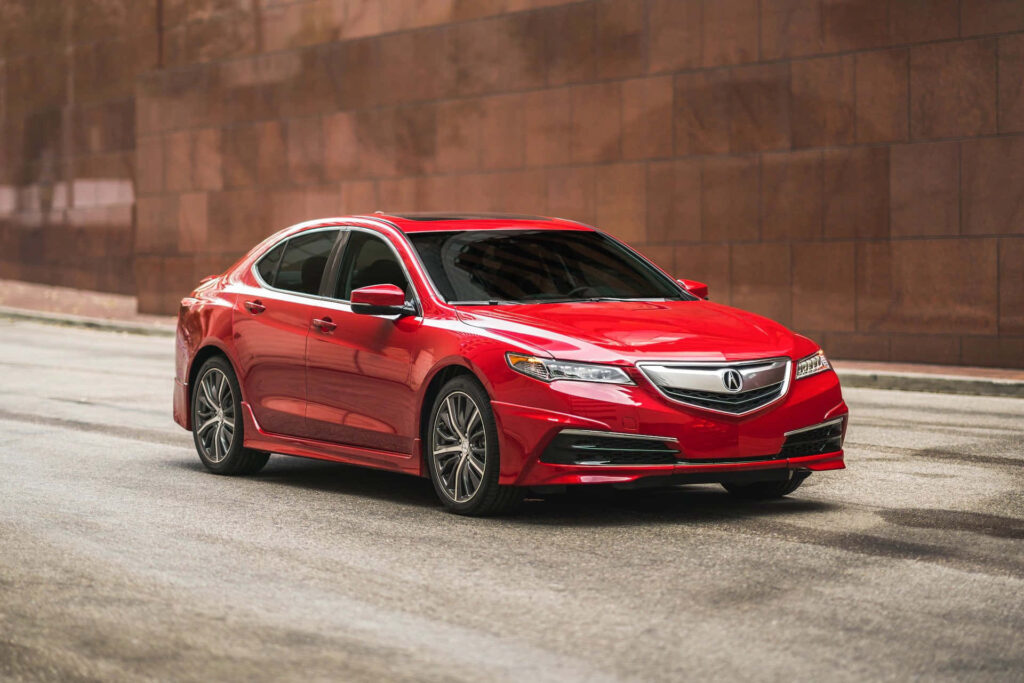 Vibrant Red Acura Sedan Wallpaper: Sleek Design for City Rides
