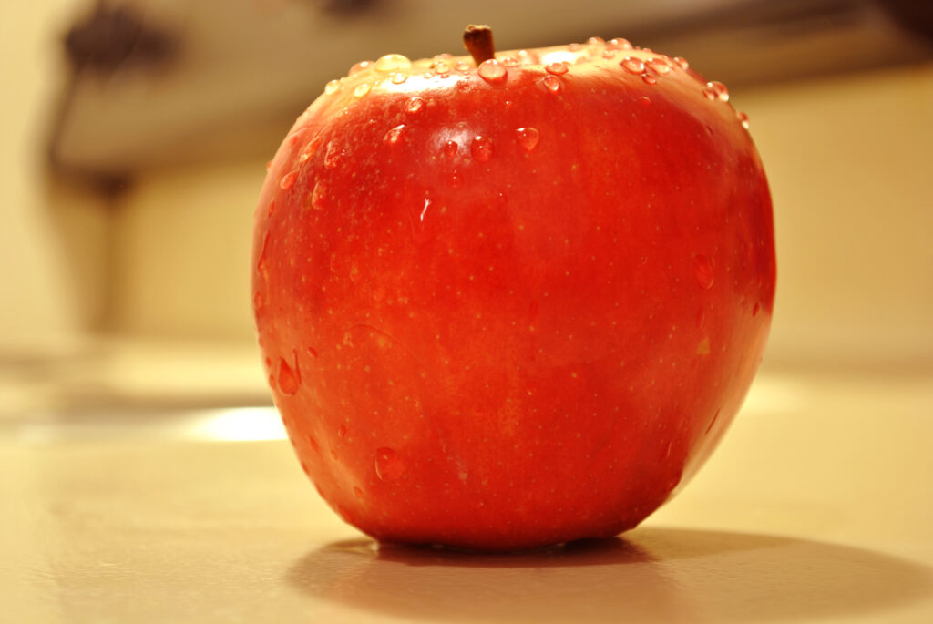 Vibrant Macro Apple with Water Droplets - Stunning Wallpaper Background