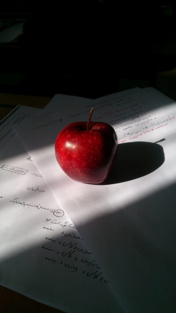 Vibrant Red Apple on Handwritten Notes - Soft Light Wallpaper