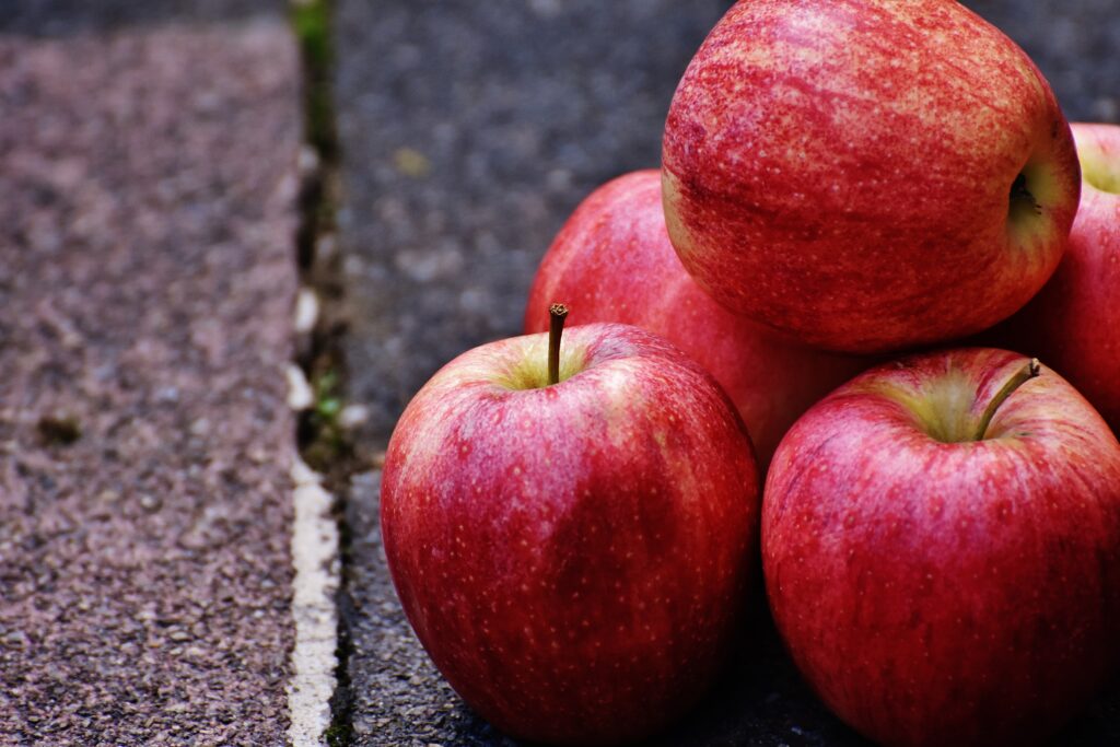 Vibrant Red Apple Wallpaper: Fresh, Textured Fruit Background