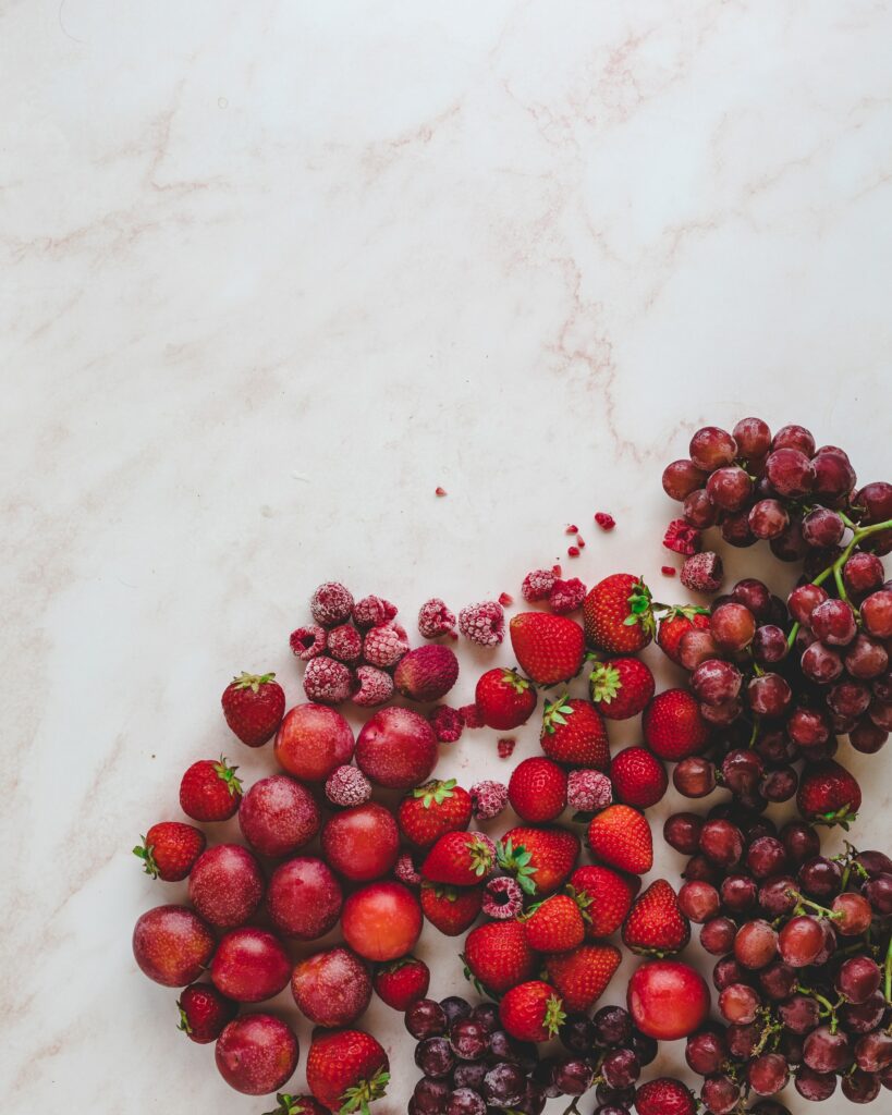 Vibrant Red Berry Wallpaper: Fresh & Frozen on Marble Background