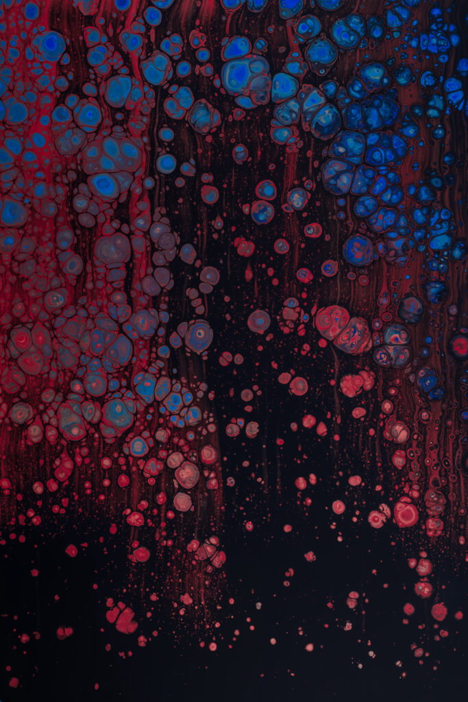 Vibrant Red and Blue Liquid Texture Macro Wallpaper Background