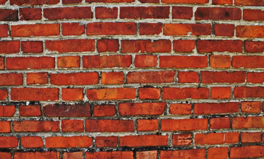 Vibrant Red Brick Wall Texture for Bold Wallpaper Background
