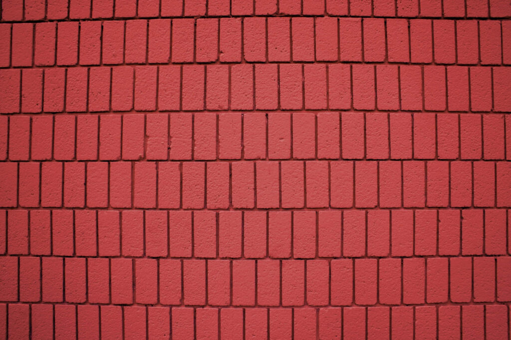 Bold Red Brick Wallpaper Background: Clean, Vibrant Texture for Design
