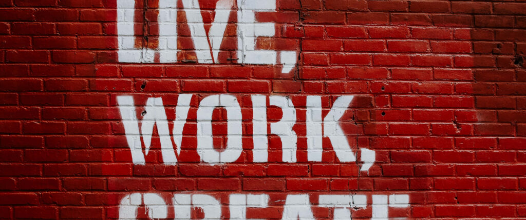 Vibrant Red Brick Wallpaper: Live, Work, Create - Motivational Wall Art
