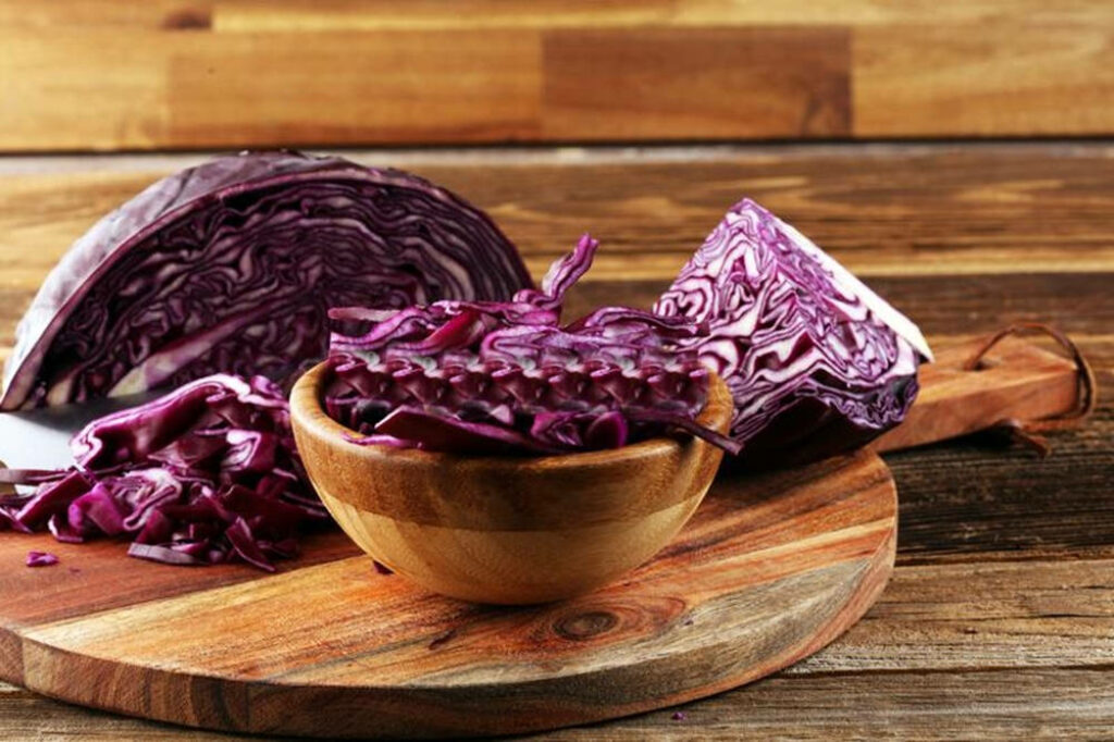 Vibrant Red Cabbage Wallpaper: Rustic Wood Background & Rich Textures