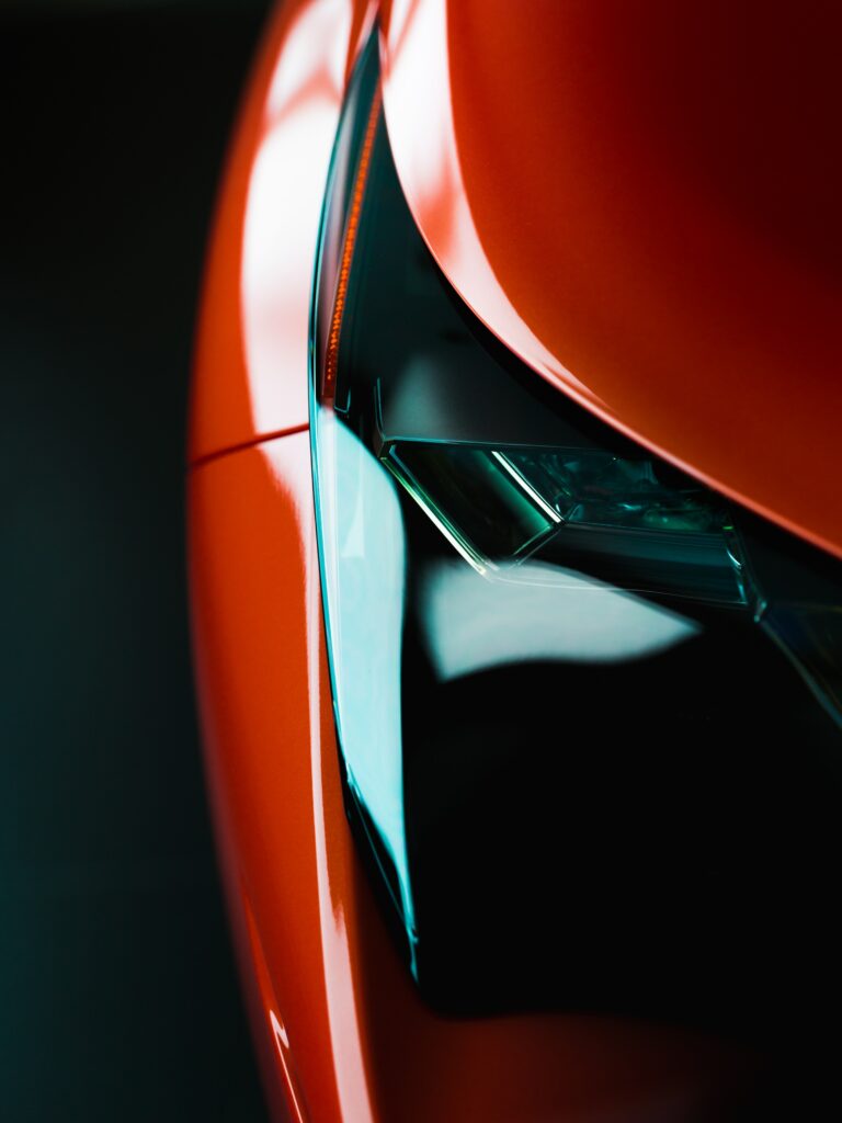 Modern Red Car Headlight Wallpaper: Sleek Design & Innovation