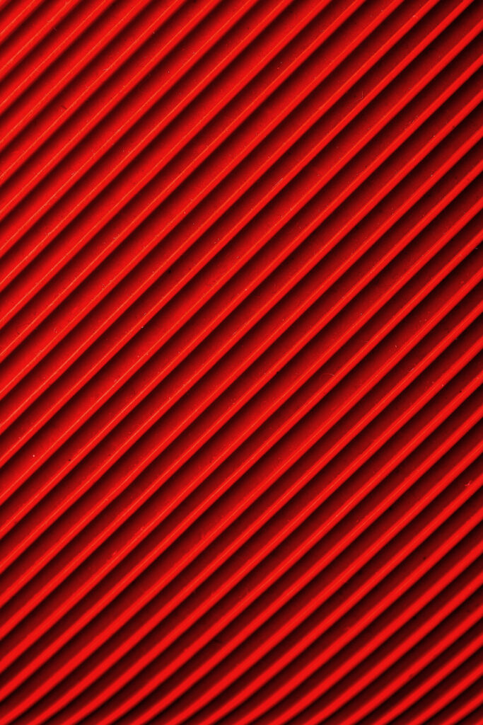 Vibrant Red Carbon Fiber Wallpaper: Dynamic Diagonal Ridges Texture