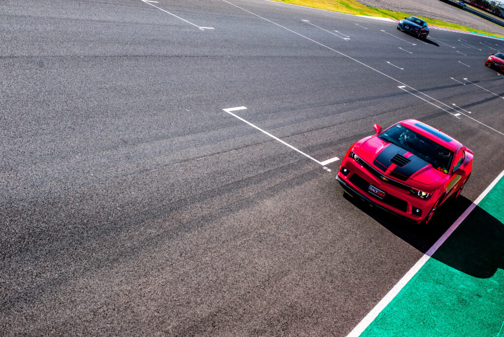 Vibrant Chevrolet Camaro Wallpaper: Sleek Speed on the Race Track
