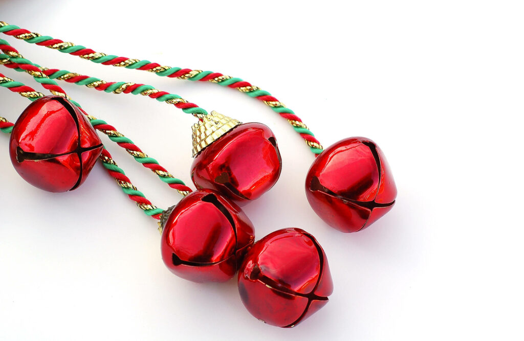 Vibrant Red Christmas Bells on White Background - Festive Wallpaper
