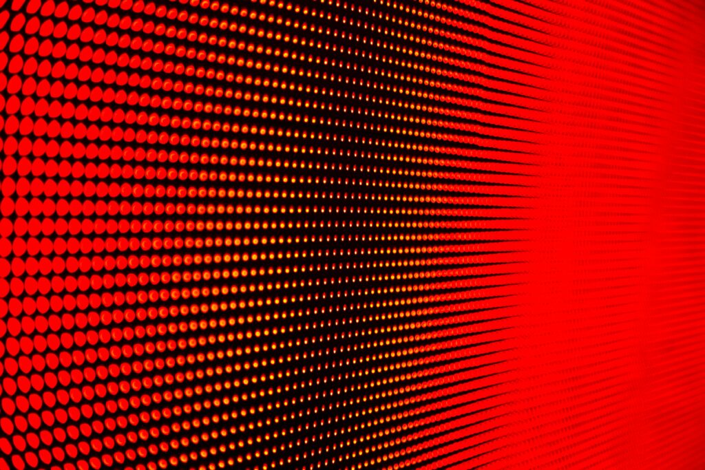 Dynamic Red Background Wallpaper with Vibrant Circle Pattern