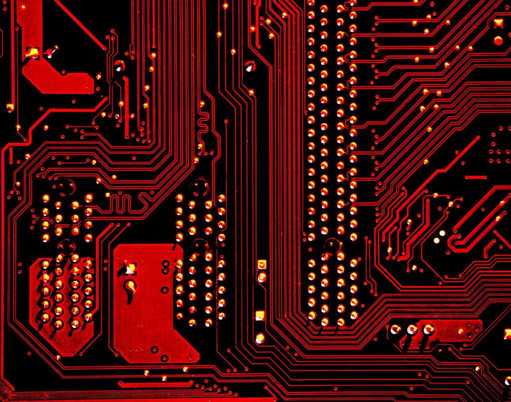Vibrant Red Circuit Board Wallpaper: Intricate Tech Patterns & Pathways