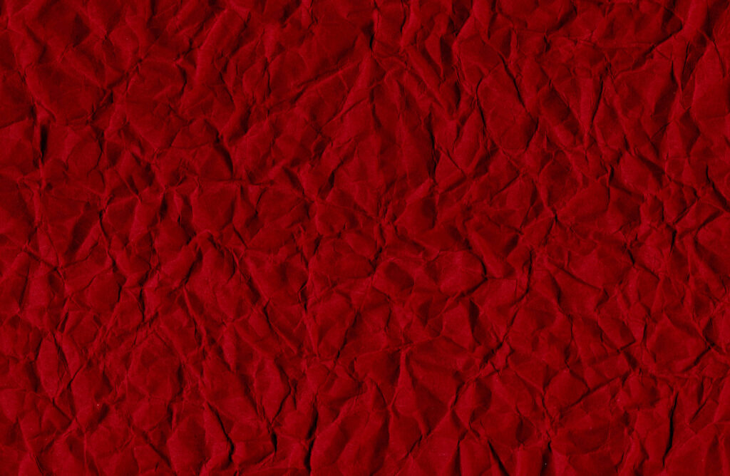 Vibrant Red Textured Crumpled Paper Wallpaper Background