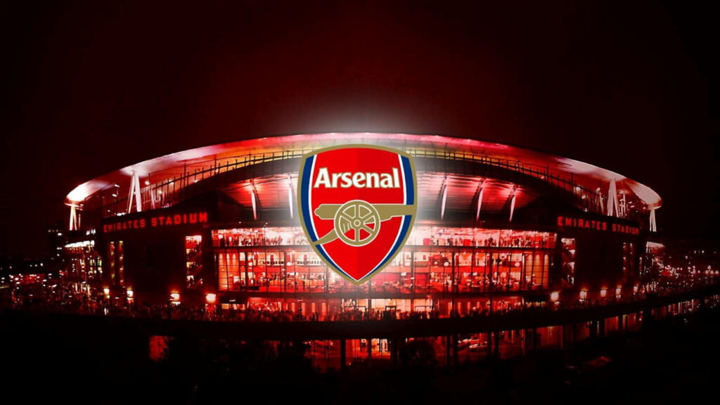 Emirates Stadium red wallpaper with bold Arsenal crest iconic home of Arsenal FC background