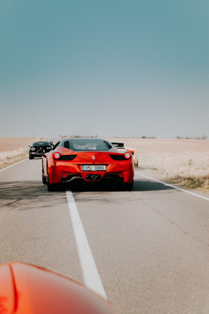 Vibrant Red Ferrari 458 in Motion: Stunning Wallpaper Background