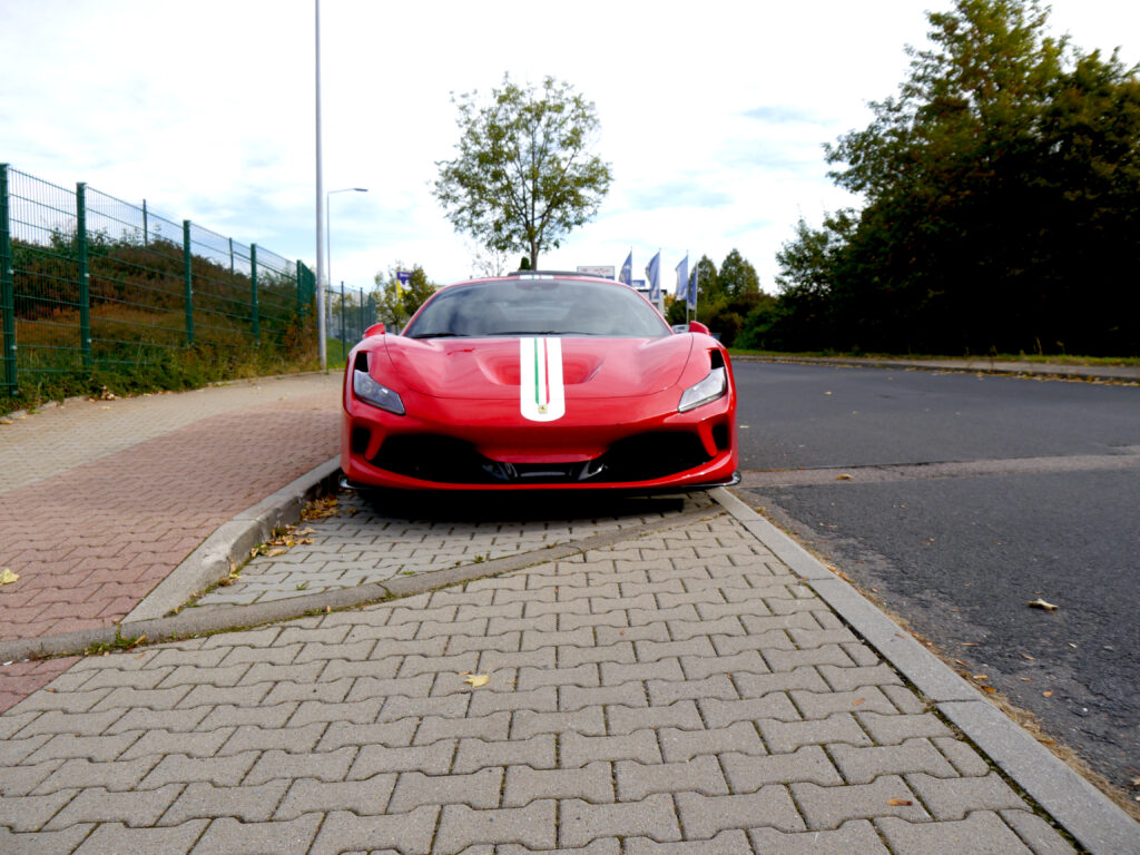 Stunning Red Ferrari Wallpaper: Iconic Style Against Urban Backdrop