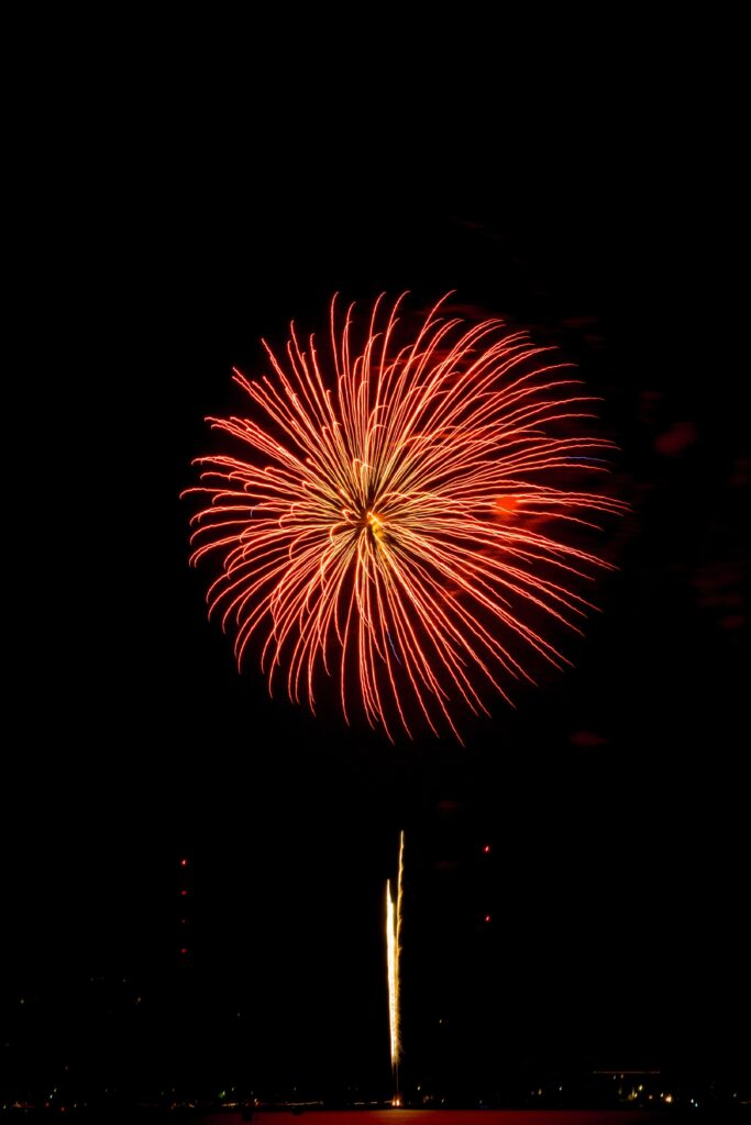 Vibrant Red Firework Wallpaper: Night Sky Sparks & Trails