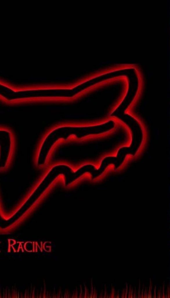 Fox Racing glowing red Fox head logo on black background motocross wallpaper background
