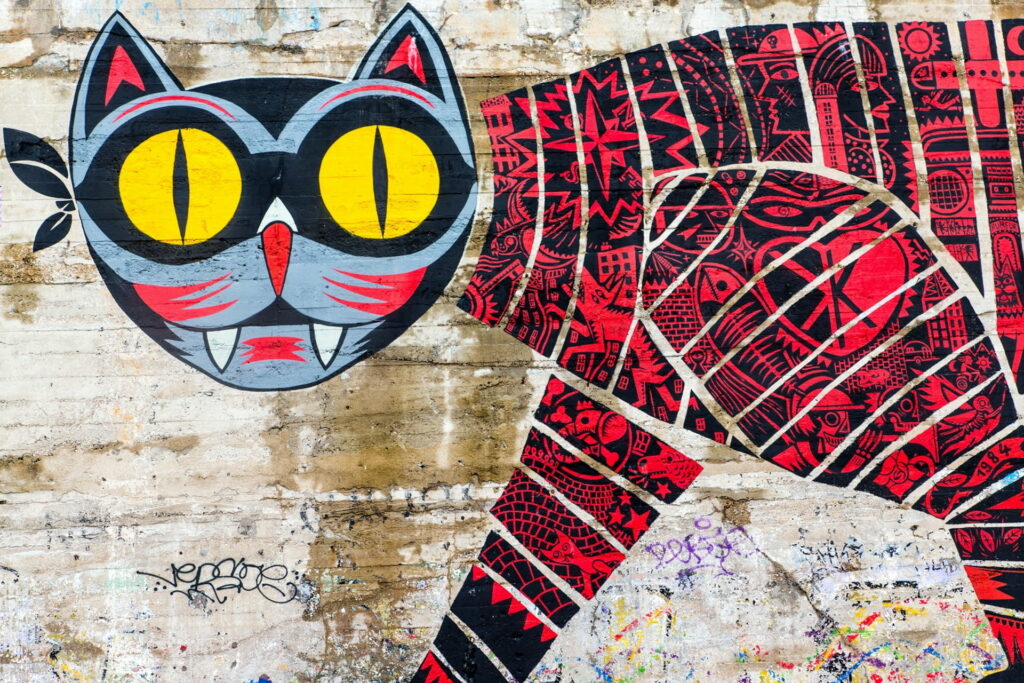 Vibrant Feline: Exploring Fierce Graffiti Art with Yellow Texture - Stunning HD Wallpaper Background