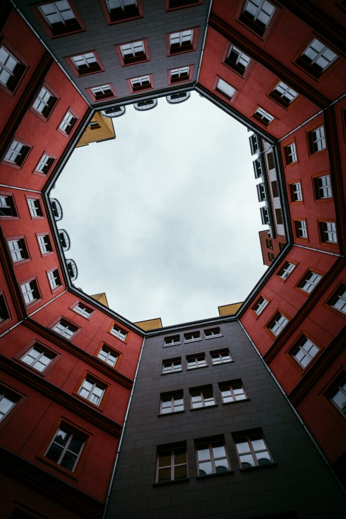 Vibrant Red and Gray Building Wallpaper: Stunning Geometric View