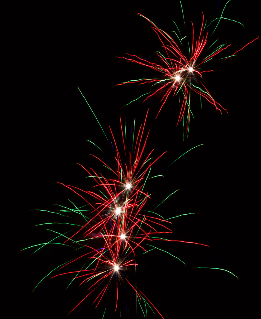 Vibrant Red and Green Fireworks Wallpaper Background - 2590x3168