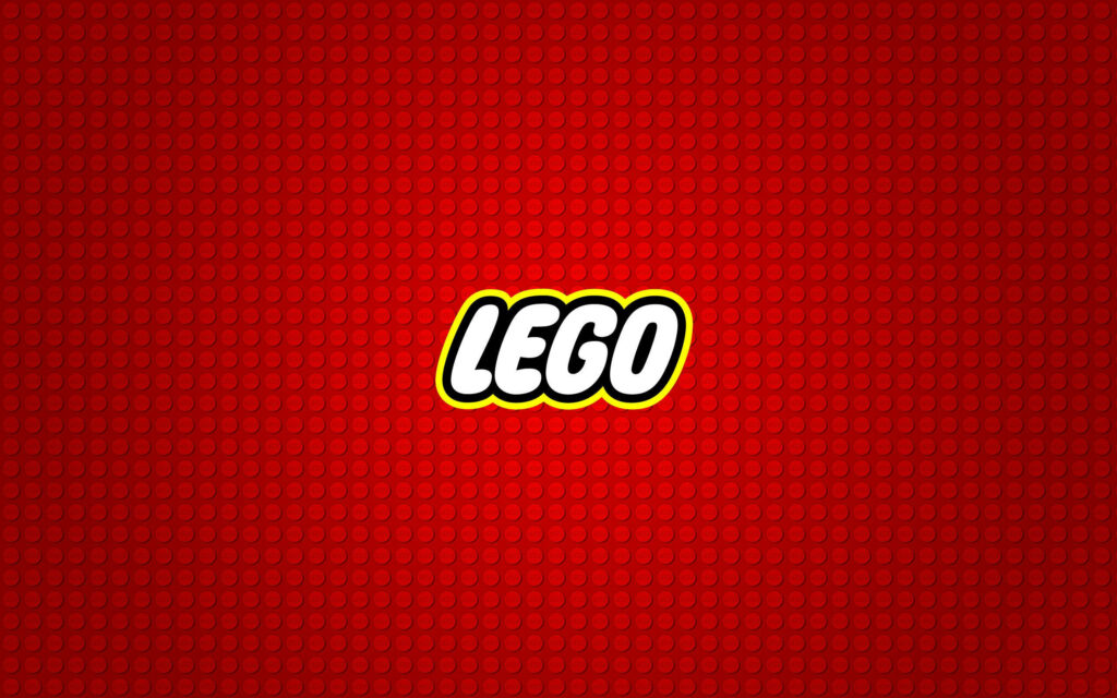 Vibrant LEGO Mosaic: Dotted Red Background with Central LEGO Logo Wallpaper