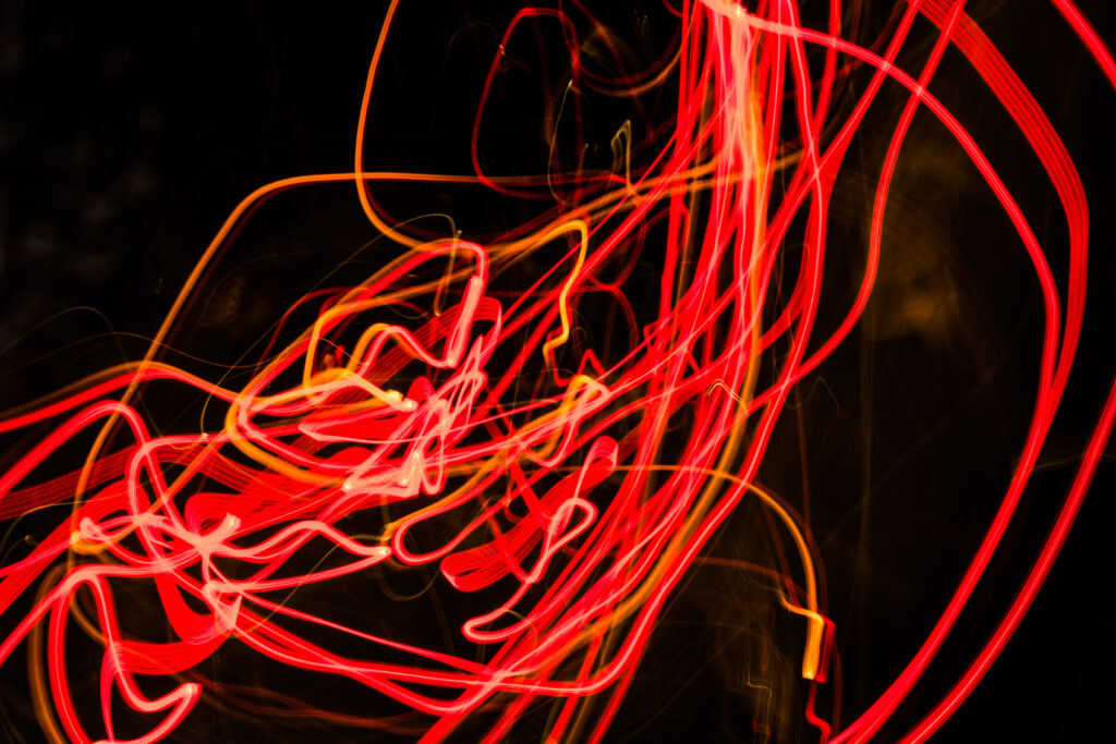 Vibrant Red Light Trails: Abstract Modern Wallpaper Background