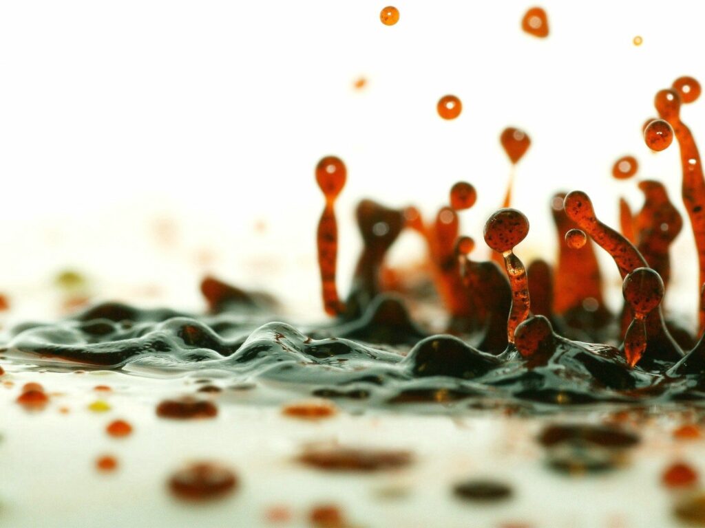 Vibrant Red Liquid Splash Wallpaper: Striking Abstract Background