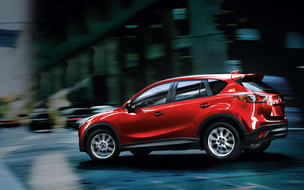 Dynamic Red Mazda CX-5 in Motion: Stunning Urban Wallpaper